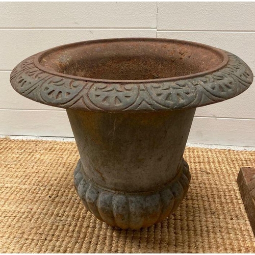 278 - A selection of cast iron garden items to include a planter or urn and a pierced basket