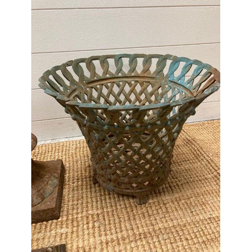 278 - A selection of cast iron garden items to include a planter or urn and a pierced basket