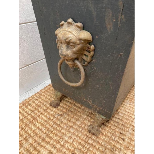 279 - A dark grey painted wooden planter with lion heads handles on lion paw feet