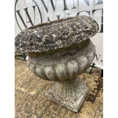 282 - A pair of gadrooned garden urns (38cm x 40cm)