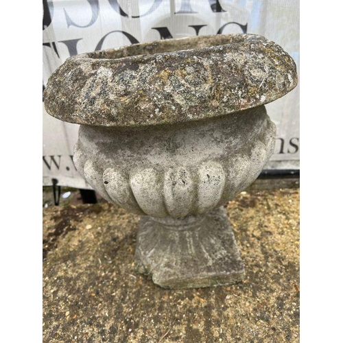 282 - A pair of gadrooned garden urns (38cm x 40cm)