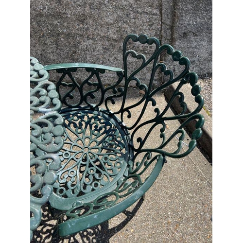 288 - A metal garden table with four chairs with scrolling design (H68cm Dia100cm)