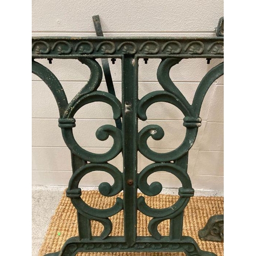 293 - Two wrought iron green painted garden table legs