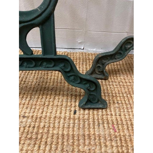 293 - Two wrought iron green painted garden table legs