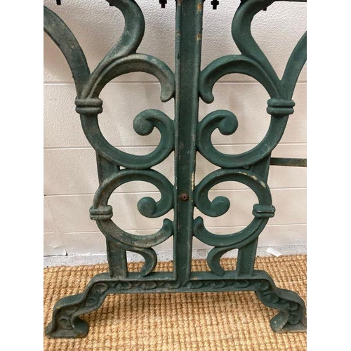 293 - Two wrought iron green painted garden table legs