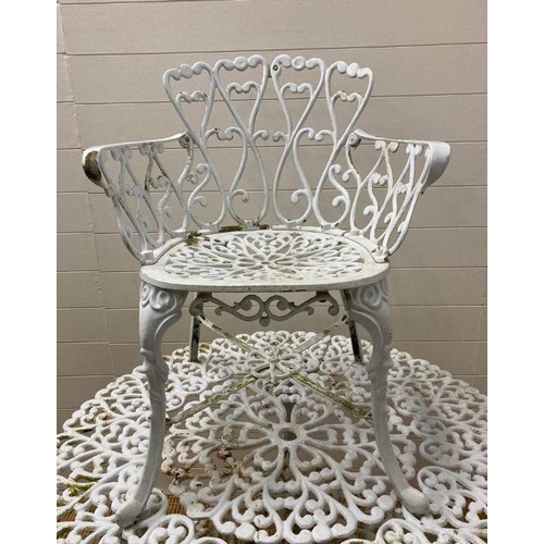 301 - A white painted metal garden table and three chairs