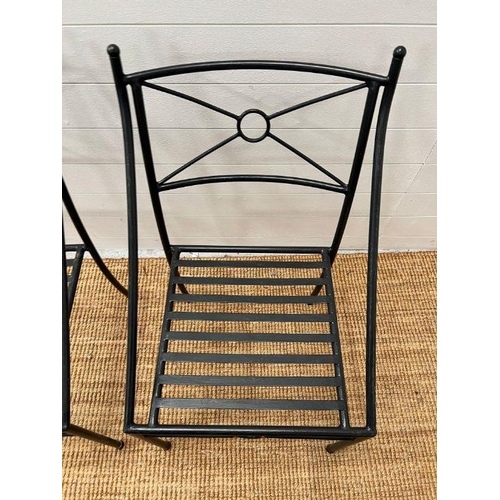 303 - Two wrought iron garden chairs