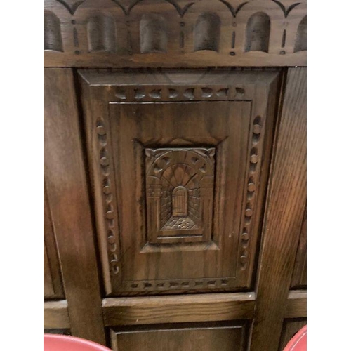 32 - An oak carved Arts and Crafts style bar with Palace of Westminster motif and two stools (H107cm W150... 