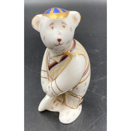 347 - Two boxed Royal Crown Derby paperweights, Cricketer and school boy Teddy, one with gold stopper.