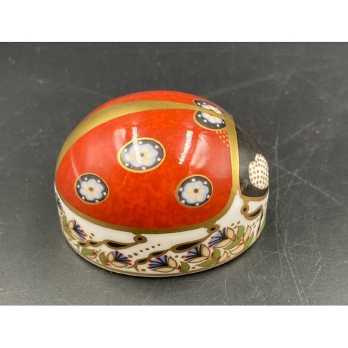 352 - Two boxed Royal Crown Derby paperweights, Ladybird and Teddy Bear, one with silver stopper