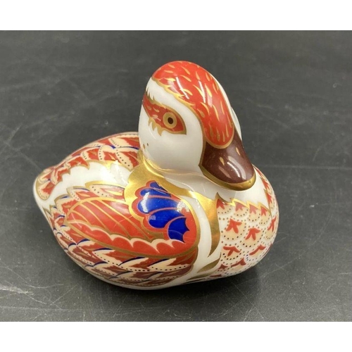 353 - Two boxed Royal Crown Derby paperweights, Duckling and a bird, both with gold stoppers