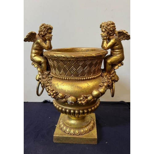 379 - A gilt vase with cupids to side