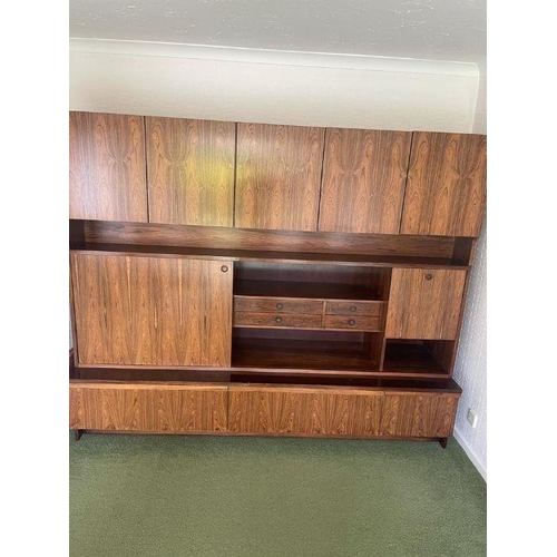 38 - A large Mid Century wall unit with three drawers under, three cupboards over and a middle section wi... 
