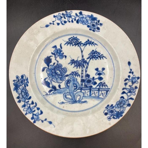 385 - An 18th Century Chinese Blue and white plate with floral design. (23.5cm Diameter)