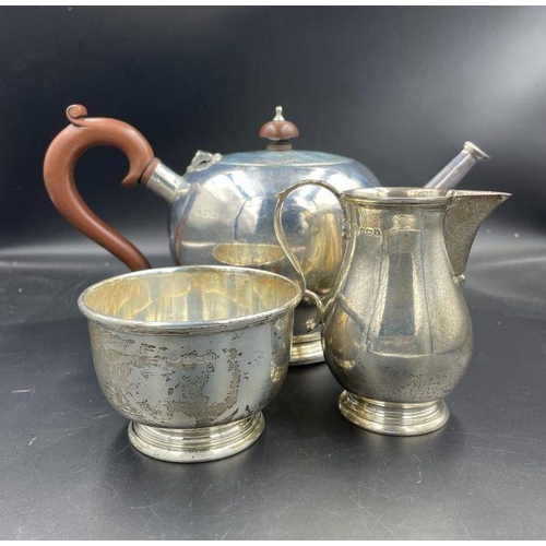 401 - A Three piece silver tea service comprising teapot, sugar bowl and milk jug by Blackmore & Fletcher ... 