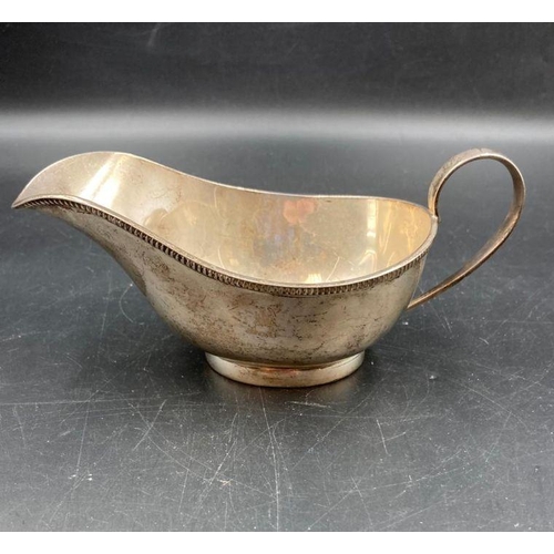 411 - A silver sauce boat by Stower & Wragg Ltd hallmarked for Sheffield 1933