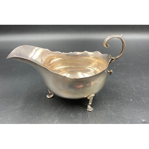 414 - A silver sauce boat on three hoof feet, hallmarked for Chester, dated 1905 by Haseler Brothers