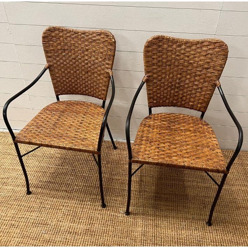 42 - A pair of wicker side chairs with metal frame