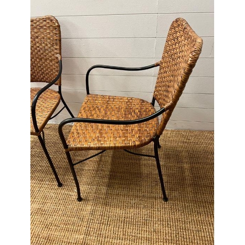 42 - A pair of wicker side chairs with metal frame