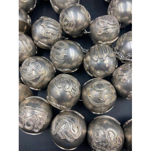 425 - A large set of Arabian silver worry beads approximately 1400g