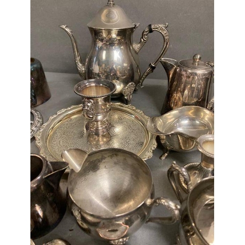 436 - A quantity of silver plate items to include coffe pot, milk jugs and candle sticks