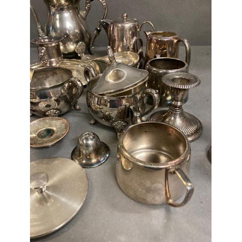 436 - A quantity of silver plate items to include coffe pot, milk jugs and candle sticks