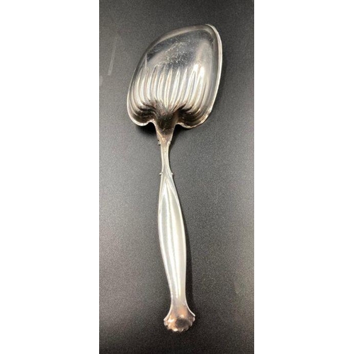 439 - A Sterling silver serving spoon with shell handle by WHITING MANUFACTURING COMPANY