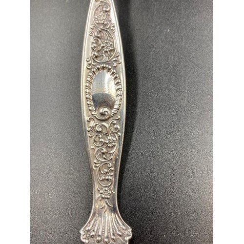 439 - A Sterling silver serving spoon with shell handle by WHITING MANUFACTURING COMPANY