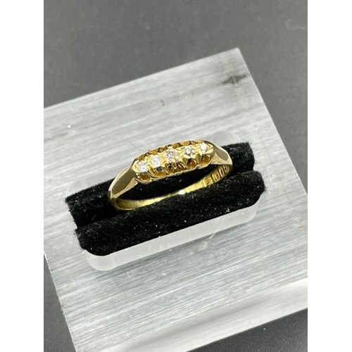 447 - A five stone 18ct yellow gold ring, approximate total weight 2.5g