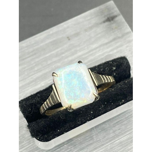 469 - A 9ct gold and opal ring