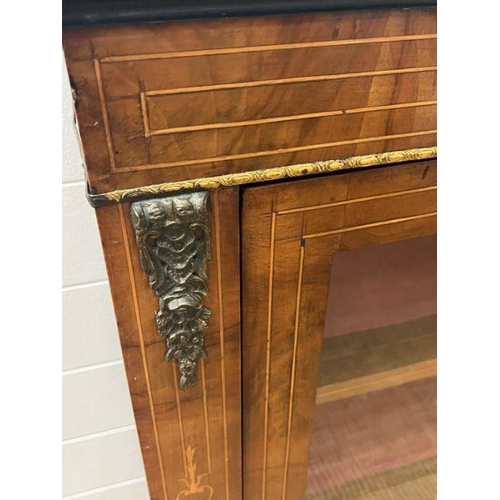 47 - A mahogany string inlaid glazed cabinet with gilt metal mounts (H94cm W73cm D30cm)
