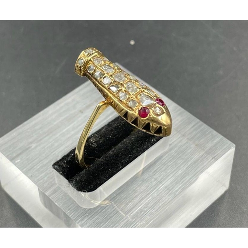 477 - An old cut diamond ringin a gold setting in the form of a coffin.