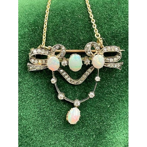 480 - An antique opal and diamond brooch with added gold chain.