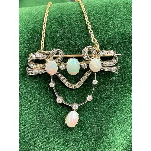 480 - An antique opal and diamond brooch with added gold chain.