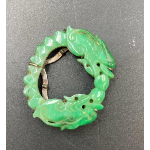 482 - A Jade brooch and earring set.