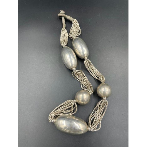 486 - A large silver antique necklace with large silver balls.