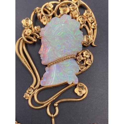 491 - An 18ct gold Victorian style necklace with an opal centre carved stone