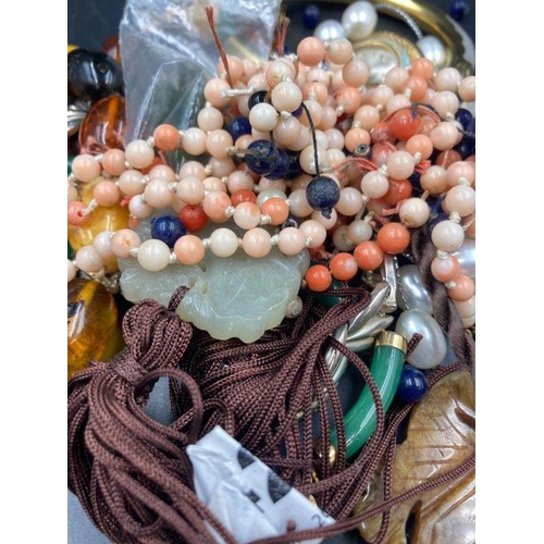 504 - A selection of amber, jade and coral and some costume jewellery