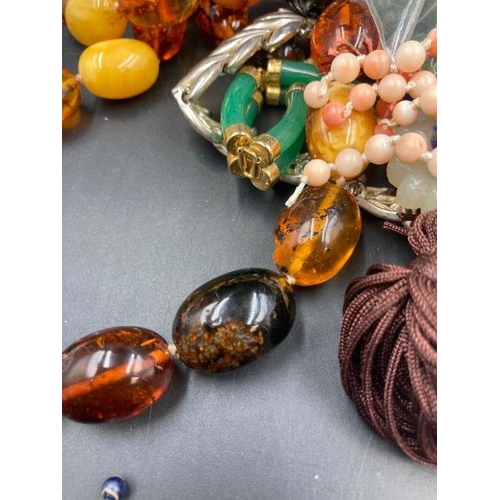 504 - A selection of amber, jade and coral and some costume jewellery