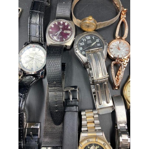 522 - A large selection of wristwatches, various makers and styles.