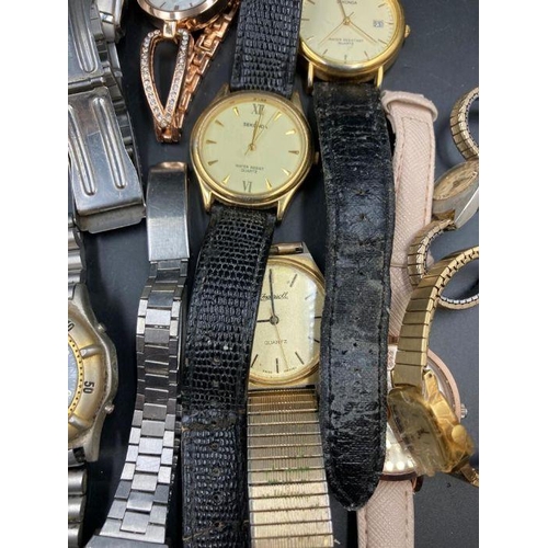 522 - A large selection of wristwatches, various makers and styles.