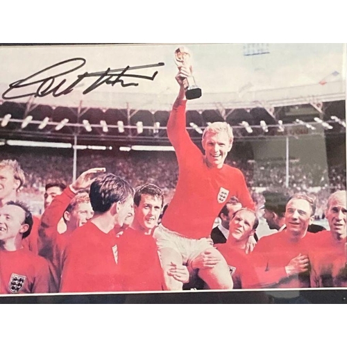 529 - A World Cup heroes of 1966 sovereign Coin First Day Cover to include a signed photograph of Bobby Mo... 