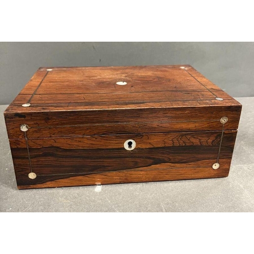 53 - A Victorian rosewood and mother of pearl work box with the hinged lid opening to a lined interior