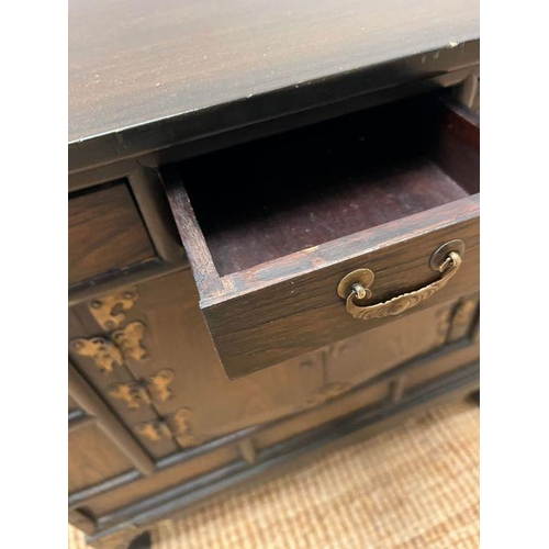 55 - A Korean style cabinet with small drawers, running across the top and a cabinet below