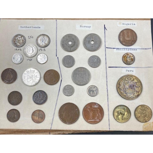 569 - A selection of International coins mounted on board, including Australia, Austria, Belgium, Brazil, ... 