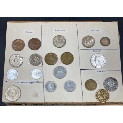 569 - A selection of International coins mounted on board, including Australia, Austria, Belgium, Brazil, ... 