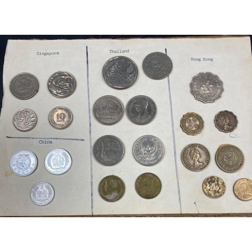 569 - A selection of International coins mounted on board, including Australia, Austria, Belgium, Brazil, ... 