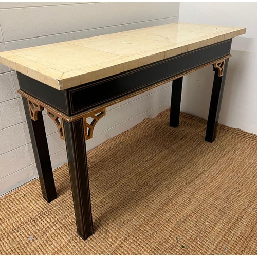 57 - A console table on ebony style legs and gilt string inlaid (H70cm W117cm D44cm) (Top AF)