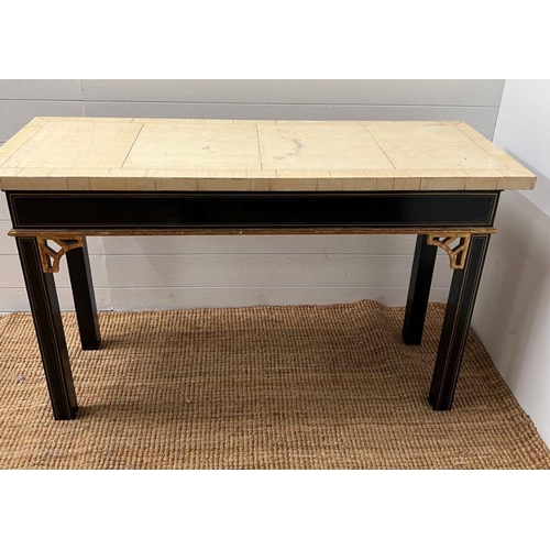 57 - A console table on ebony style legs and gilt string inlaid (H70cm W117cm D44cm) (Top AF)