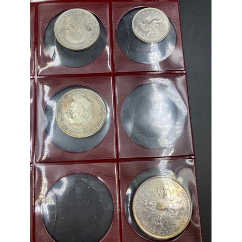 570 - A selection of coins to include: A Marie Theresa, Russian Rouble, 1927 USA silver dollar etc.